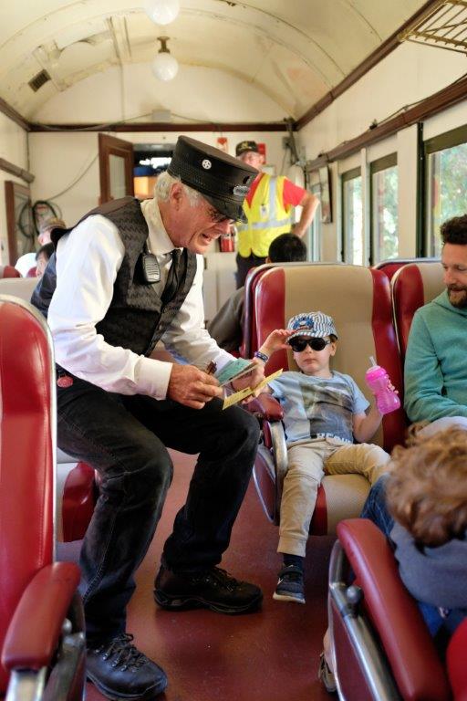 Brakeman Warren Haack punching passenger's tickets on WP 315.JPG