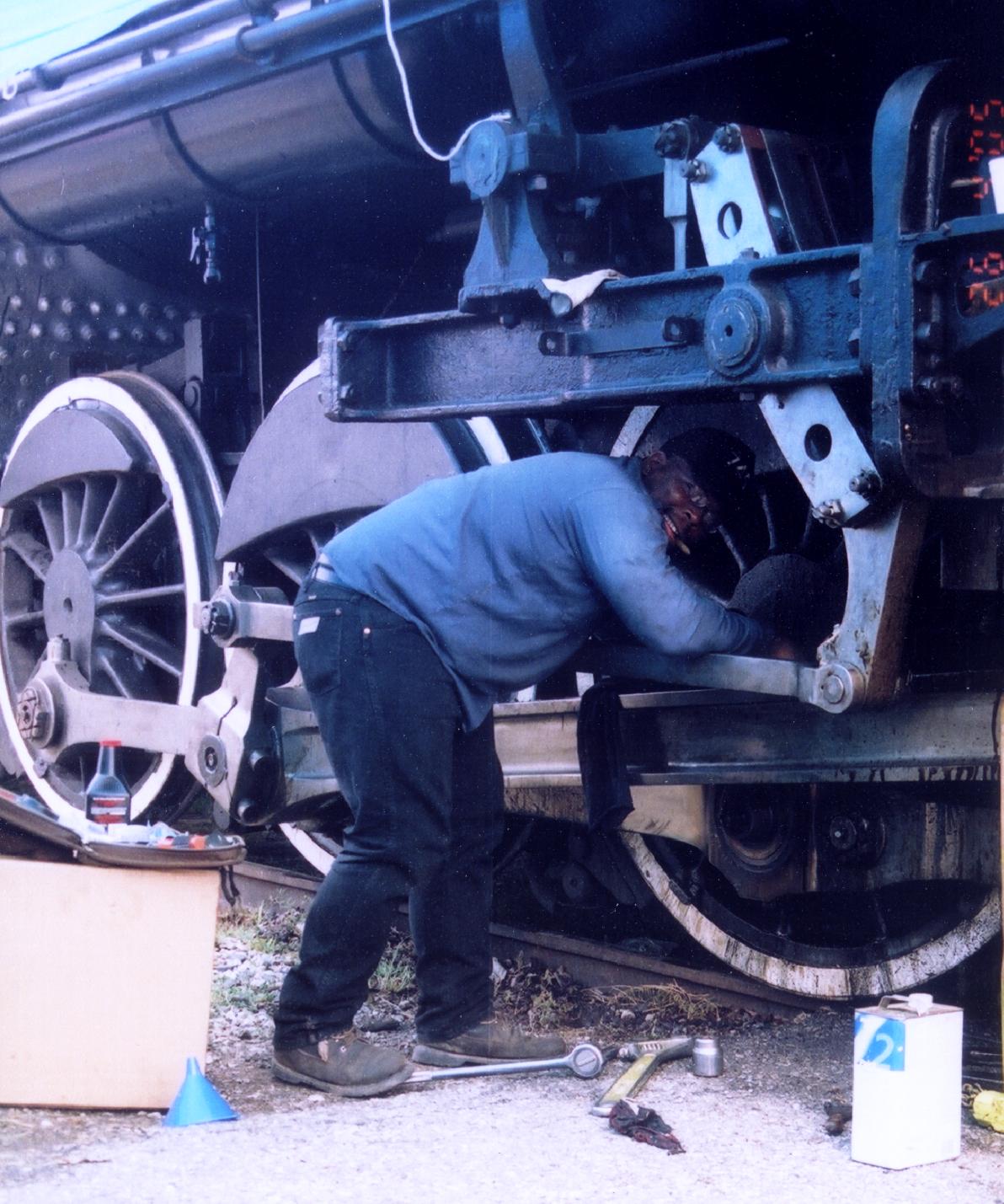 SP 745#9 Ken Cotton wraps up work on the #2 bearing.JPG
